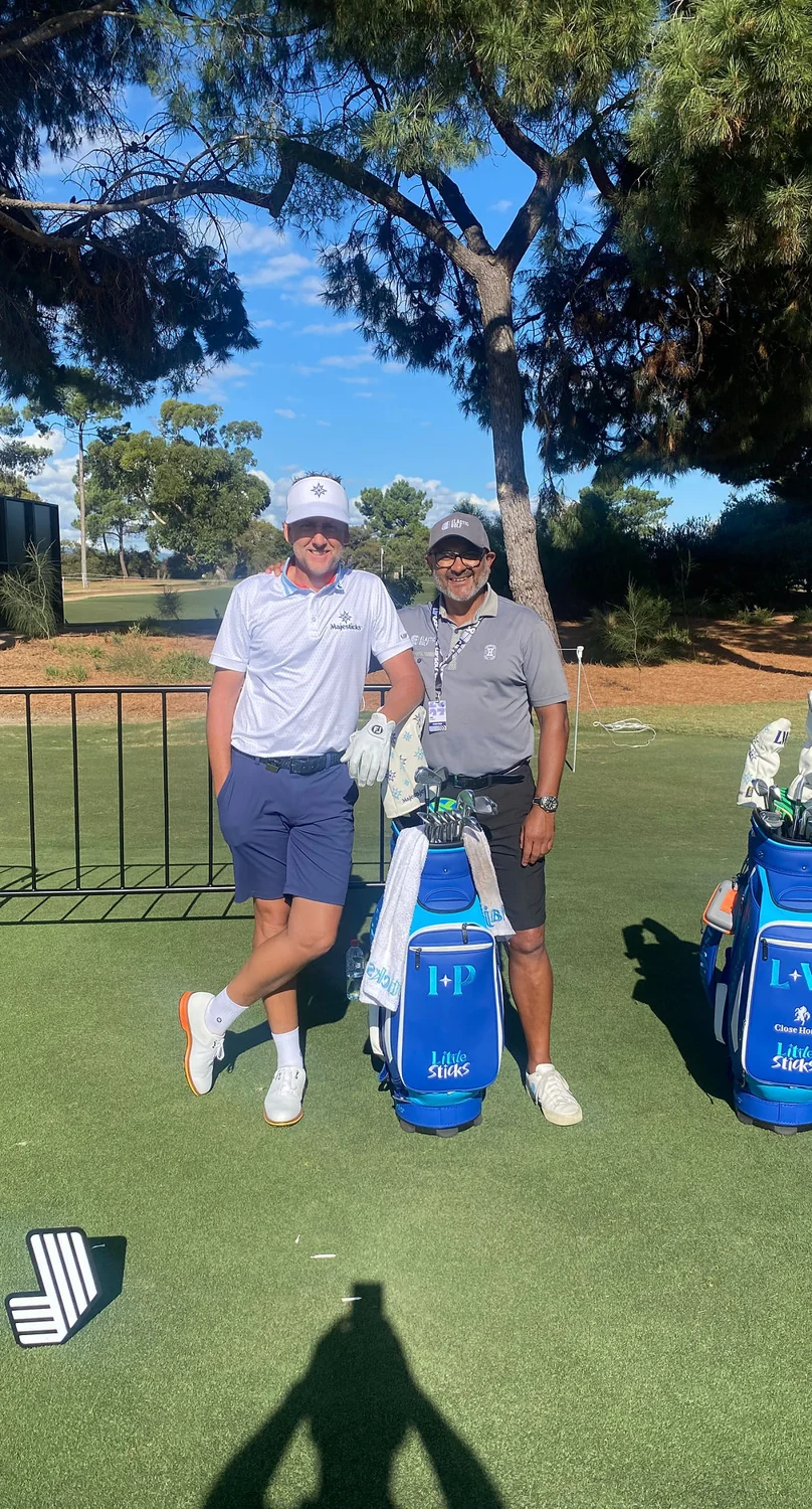 Kam Bhabra with Ian Poulter on a golf course
