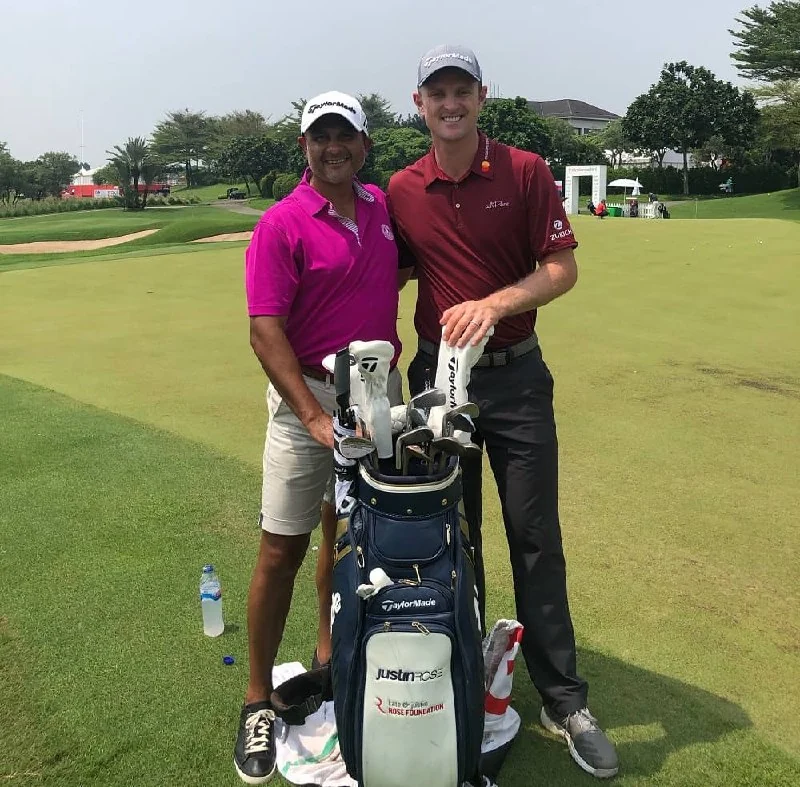 Kam Bhabra with Justin Rose on a golf course