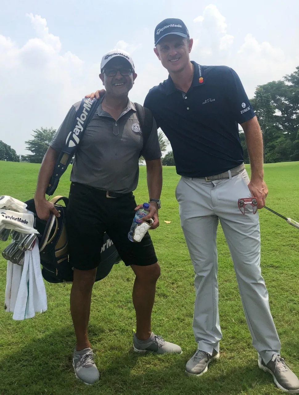 Kam Bhabra with Major champion Justin Rose on the course during the PGA Tour